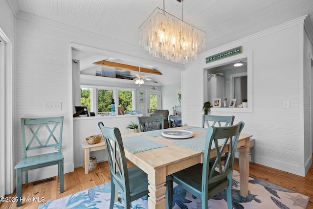 210 Upchurch Dr, Newport, NC 28570 - dining room with a chandelier, wood finished floors, ceiling fan, and crown molding