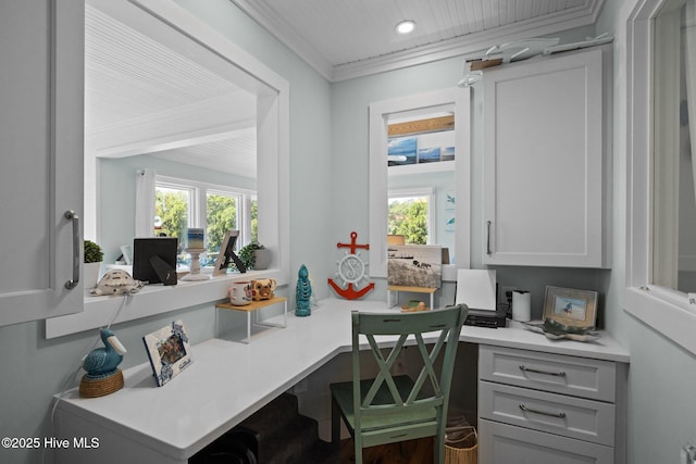 210 Upchurch Dr, Newport, NC 28570 - home office with crown molding, healthy amount of natural light, built in desk, and recessed lighting