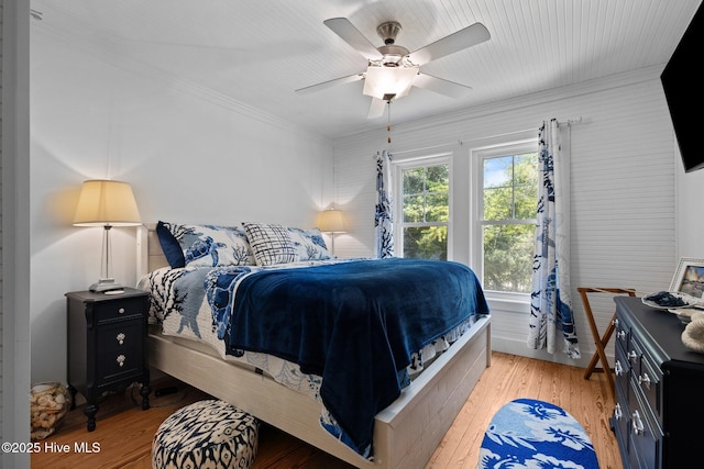 210 Upchurch Dr, Newport, NC 28570 - bedroom with wood finished floors, crown molding, and a ceiling fan