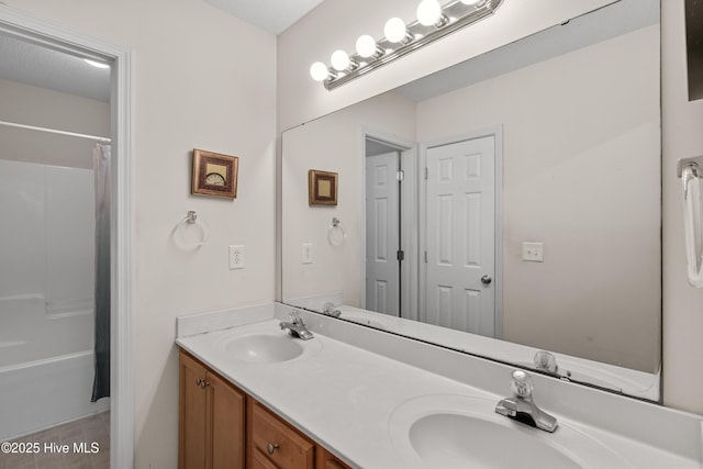 4399 Owendon Dr, Shallotte, NC 28470 - bathroom with double vanity and shower / tub combo with curtain