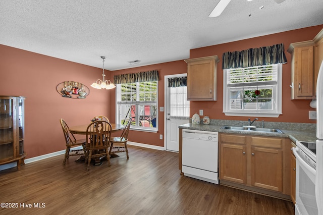 4399 Owendon Dr, Shallotte, NC 28470 - kitchen with white appliances, a textured ceiling, dark wood-style flooring, a ceiling fan, and hanging light fixtures