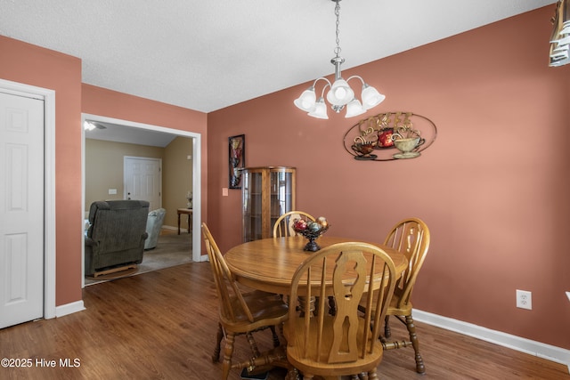 4399 Owendon Dr, Shallotte, NC 28470 - dining room featuring wood finished floors and a chandelier