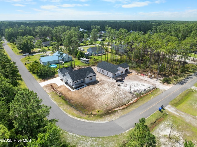 1990 Salisbury Rd, Southport, NC 28461 - aerial view of property and surrounding area featuring a heavily wooded area