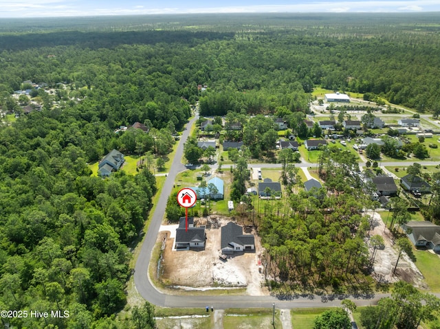 1990 Salisbury Rd, Southport, NC 28461 - aerial view of property and surrounding area with a heavily wooded area and nearby suburban area