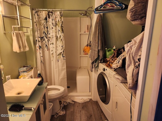 300 Morningside Dr, Vanceboro, NC 28586 - bathroom featuring a shower with curtain, wood finished floors, washer / clothes dryer, and vanity