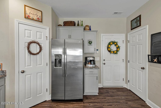 103 Baymeade Ct, Peletier, NC 28584 - kitchen featuring stainless steel fridge with ice dispenser, dark wood finished floors, and stone counters