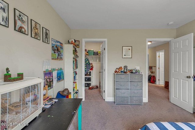 103 Baymeade Ct, Peletier, NC 28584 - carpeted bedroom featuring a walk in closet and a closet