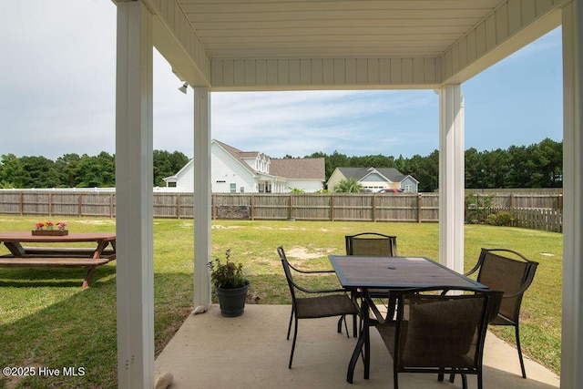 103 Baymeade Ct, Peletier, NC 28584 - fenced backyard featuring a patio area and outdoor dining space