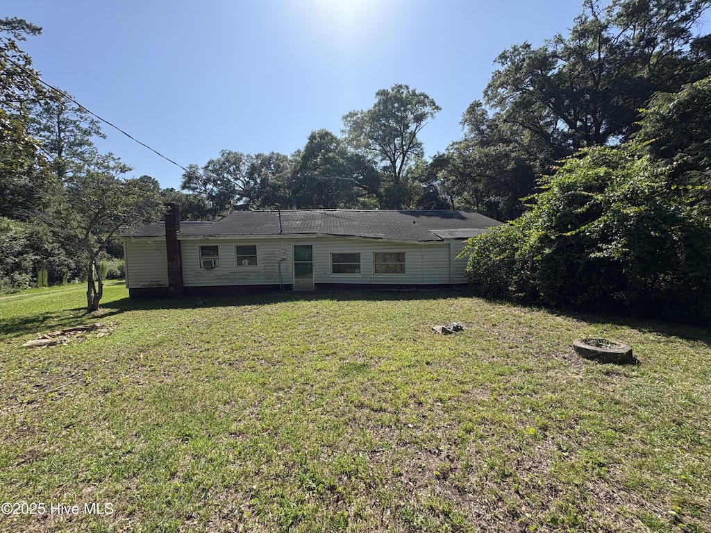 1677 Gause Landing Rd SW, Ocean Isle Beach, NC 28469 - rear view of house with a lawn