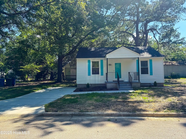 1209 Toisnot Ave NE, Wilson, NC 27893 - bungalow-style home featuring concrete driveway and covered porch