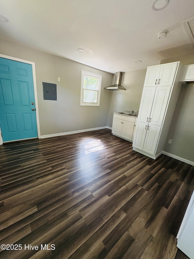1209 Toisnot Ave NE, Wilson, NC 27893 - unfurnished dining area featuring electric panel, dark wood finished floors, and recessed lighting