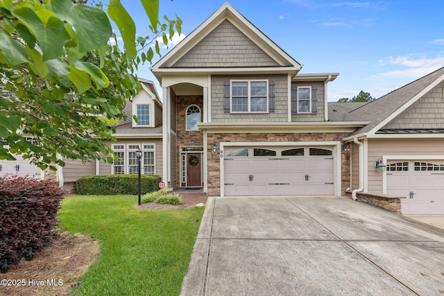 90 Shadow Creek Ct, Pinehurst, NC 28374 - view of front of home featuring driveway, stone siding, a front yard, and a garage