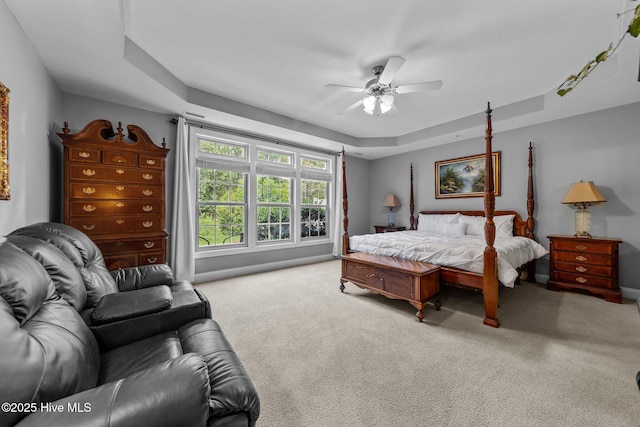 90 Shadow Creek Ct, Pinehurst, NC 28374 - carpeted bedroom featuring a tray ceiling and a ceiling fan