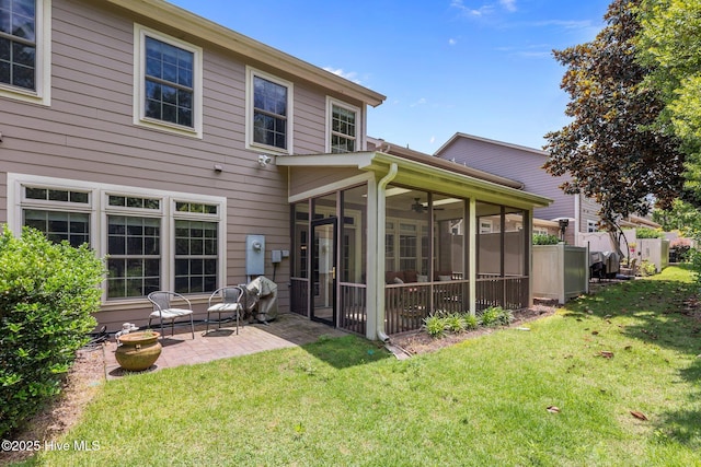 90 Shadow Creek Ct, Pinehurst, NC 28374 - back of house featuring a sunroom, a lawn, and a patio area