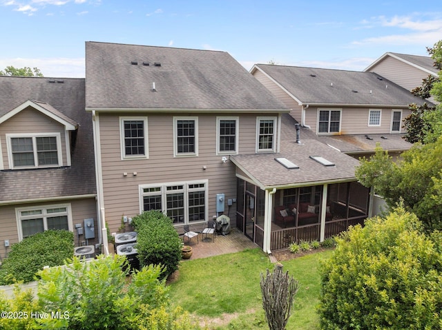 90 Shadow Creek Ct, Pinehurst, NC 28374 - rear view of house with a patio, a sunroom, roof with shingles, and a lawn