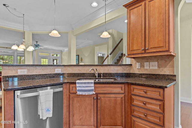 90 Shadow Creek Ct, Pinehurst, NC 28374 - kitchen featuring stainless steel dishwasher, brown cabinetry, backsplash, pendant lighting, and crown molding