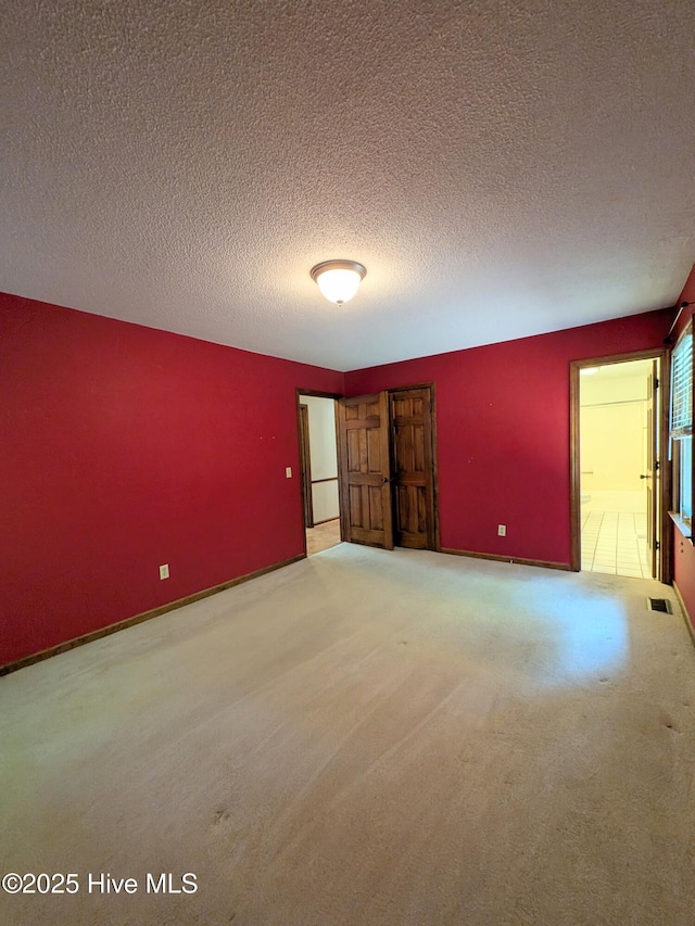 106 Brown Bark Rd, West End, NC 27376 - spare room featuring a textured ceiling and carpet floors