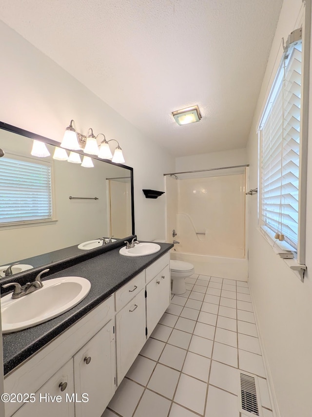 106 Brown Bark Rd, West End, NC 27376 - full bathroom featuring tile patterned flooring, double vanity, washtub / shower combination, and plenty of natural light