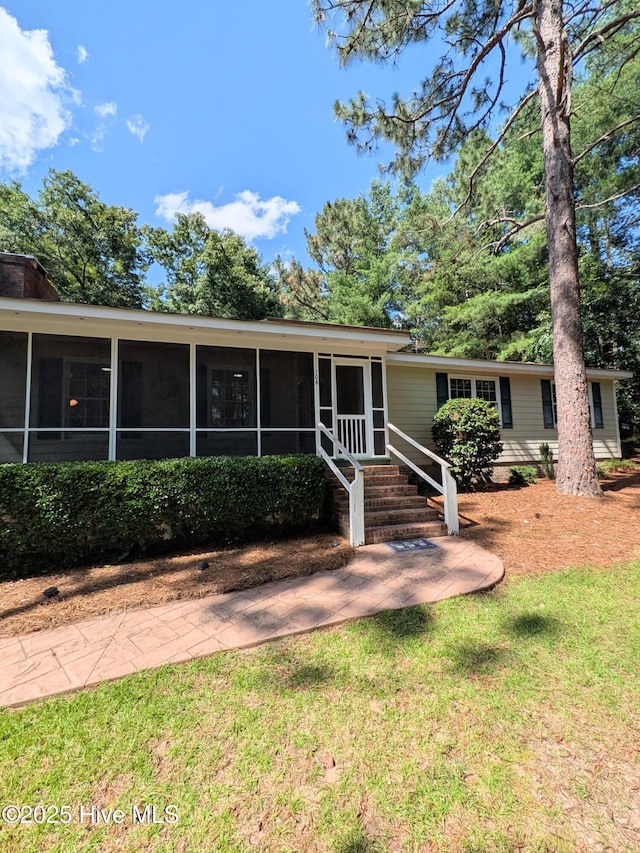 106 Brown Bark Rd, West End, NC 27376 - ranch-style home featuring a sunroom and a front yard