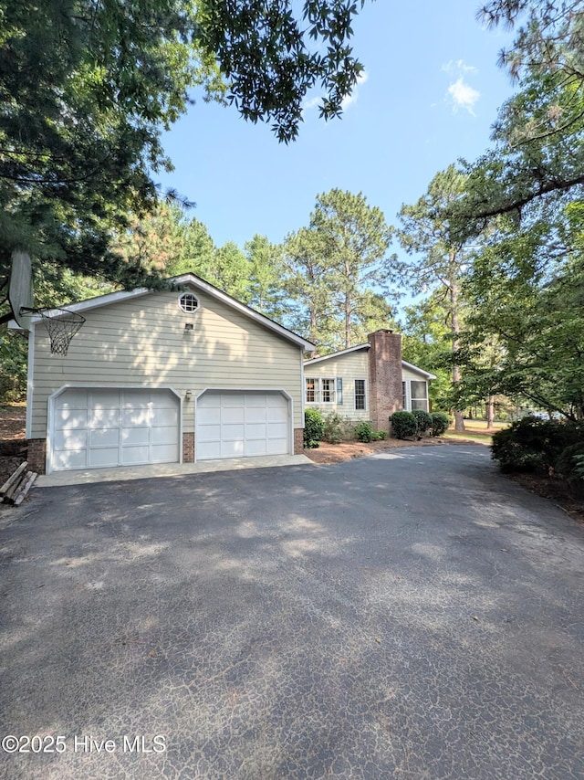 106 Brown Bark Rd, West End, NC 27376 - view of front of home featuring brick siding and an outdoor structure