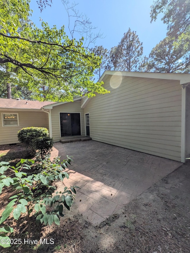 106 Brown Bark Rd, West End, NC 27376 - view of side of property featuring a patio area