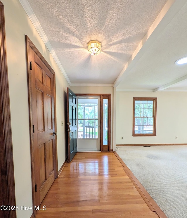 106 Brown Bark Rd, West End, NC 27376 - entrance foyer featuring a textured ceiling, light wood-style flooring, and crown molding