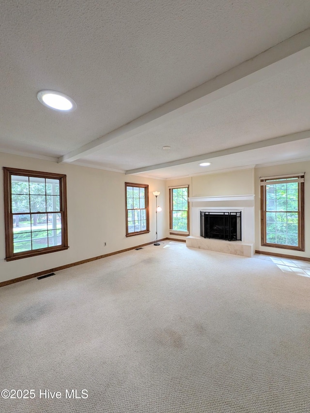106 Brown Bark Rd, West End, NC 27376 - unfurnished living room with beamed ceiling, carpet flooring, a glass covered fireplace, a textured ceiling, and recessed lighting