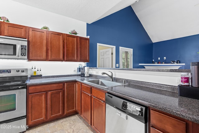 110 Whiteleaf Dr, Jacksonville, NC 28546 - kitchen with appliances with stainless steel finishes, high vaulted ceiling, and dark stone countertops