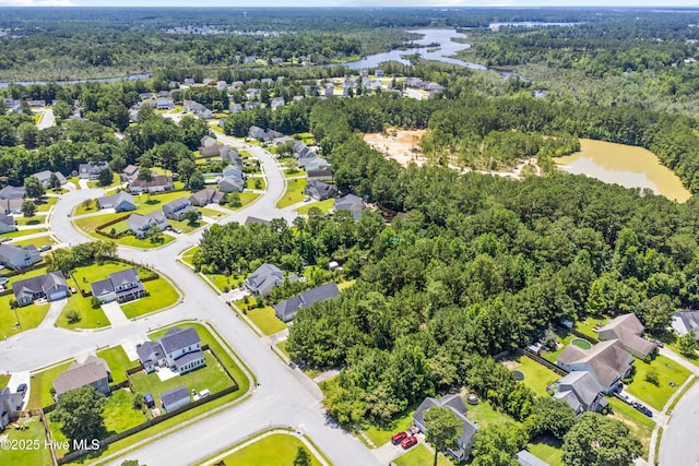 110 Whiteleaf Dr, Jacksonville, NC 28546 - aerial perspective of suburban area featuring a heavily wooded area and a large body of water