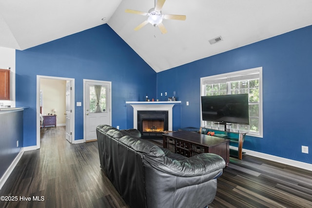 110 Whiteleaf Dr, Jacksonville, NC 28546 - living area featuring ceiling fan, dark wood finished floors, a lit fireplace, and high vaulted ceiling