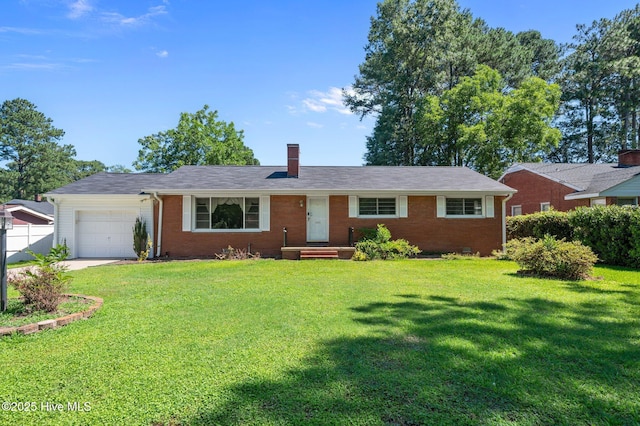 1603 Laurel St, Goldsboro, NC 27530 - single story home with a garage, a chimney, brick siding, and driveway