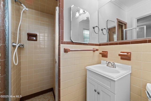 1603 Laurel St, Goldsboro, NC 27530 - full bathroom featuring a shower stall, ornamental molding, vanity, and tile walls
