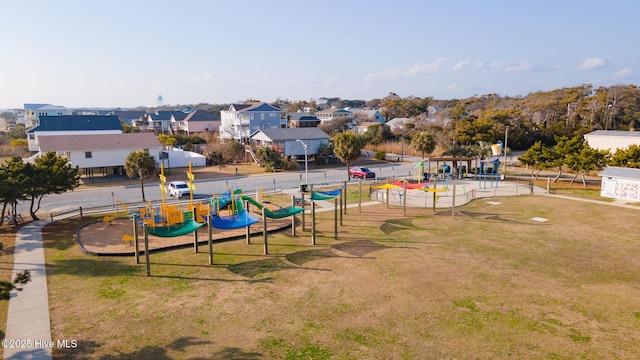163 NW 4th St, Oak Island, NC 28465 - view of property's community featuring a lawn and a residential view