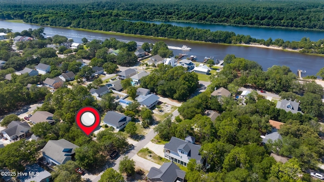 163 NW 4th St, Oak Island, NC 28465 - aerial view of property's location with a forest and nearby suburban area