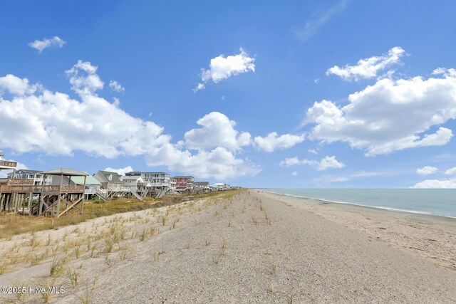 163 NW 4th St, Oak Island, NC 28465 - view of street with view of water and beach