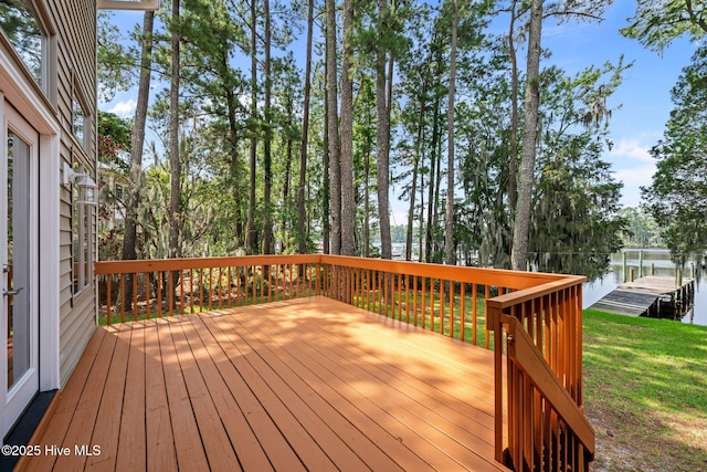 5410 Trade Winds Rd, New Bern, NC 28560 - deck with a water view, view of scattered trees, and a lawn