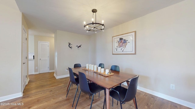 5410 Trade Winds Rd, New Bern, NC 28560 - dining room featuring a chandelier and wood finished floors