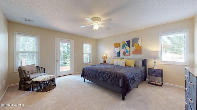 5410 Trade Winds Rd, New Bern, NC 28560 - bedroom featuring access to outside, light colored carpet, a ceiling fan, and a textured ceiling