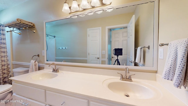 5410 Trade Winds Rd, New Bern, NC 28560 - bathroom with double vanity and a shower with shower curtain