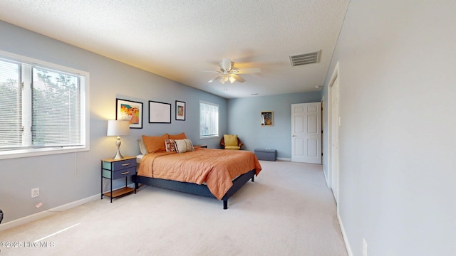 5410 Trade Winds Rd, New Bern, NC 28560 - bedroom featuring light colored carpet, a ceiling fan, and a textured ceiling