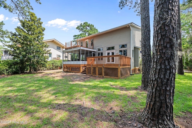 5410 Trade Winds Rd, New Bern, NC 28560 - rear view of property with a sunroom, a balcony, a lawn, and a deck