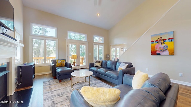 5410 Trade Winds Rd, New Bern, NC 28560 - living area featuring wood finished floors, healthy amount of natural light, a fireplace, a towering ceiling, and recessed lighting