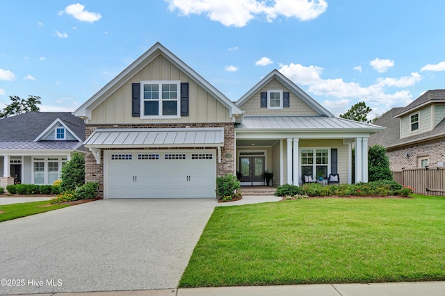 2233 Whiskey Branch Dr, Wilmington, NC 28409 - craftsman inspired home with a standing seam roof, french doors, driveway, board and batten siding, and a porch