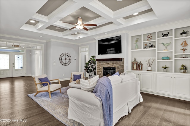 2233 Whiskey Branch Dr, Wilmington, NC 28409 - living room featuring ornamental molding, a glass covered fireplace, beamed ceiling, dark wood-type flooring, and coffered ceiling
