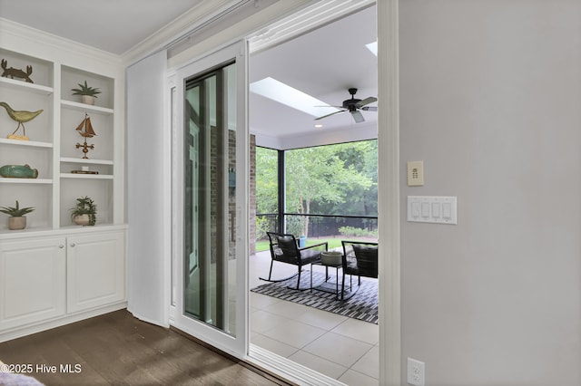 2233 Whiskey Branch Dr, Wilmington, NC 28409 - entryway with a skylight, ornamental molding, built in features, dark wood-type flooring, and a ceiling fan