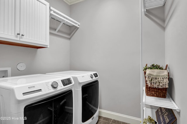 2233 Whiskey Branch Dr, Wilmington, NC 28409 - washroom featuring cabinet space, washer and dryer, and dark tile patterned floors