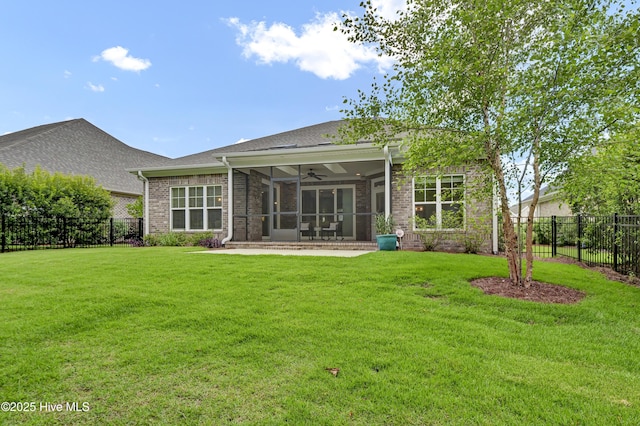 2233 Whiskey Branch Dr, Wilmington, NC 28409 - back of house with a ceiling fan, a sunroom, brick siding, and a shingled roof