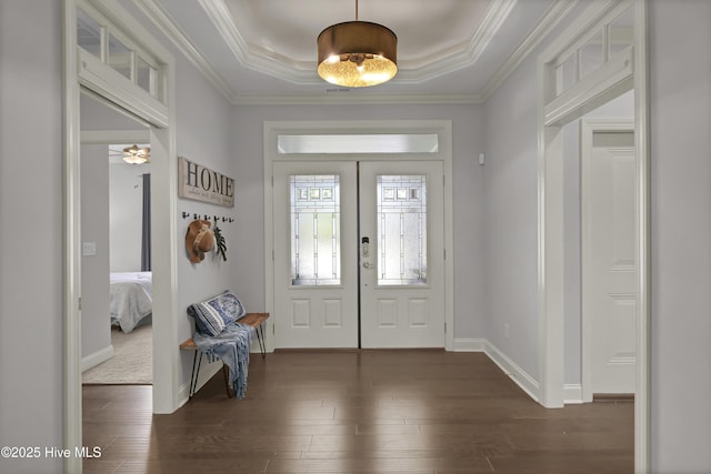 2233 Whiskey Branch Dr, Wilmington, NC 28409 - foyer entrance with dark wood-type flooring, french doors, a raised ceiling, and ornamental molding