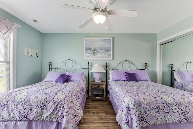 1726 W Beach Dr, Oak Island, NC 28465 - bedroom with wood finished floors, a closet, and ceiling fan