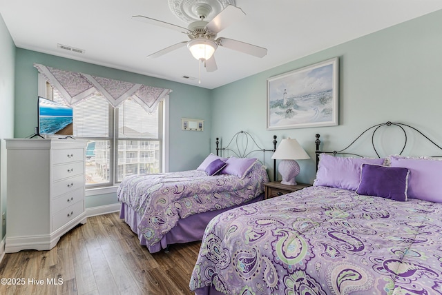 1726 W Beach Dr, Oak Island, NC 28465 - bedroom featuring wood finished floors and ceiling fan